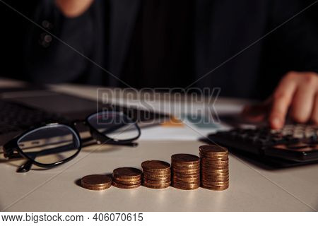 Business Accounting With Saving Money With Hand Calculate Profit