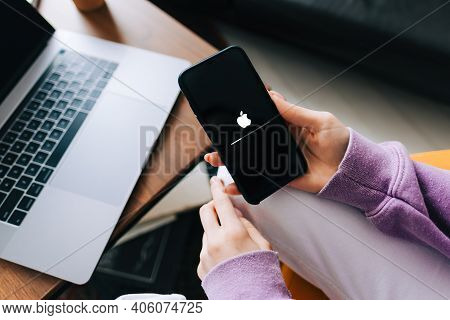 Hand Hold The Iphone With Ios Firmware Update Process On The Screen. Rostov-on-don, Russia. 25 Janua