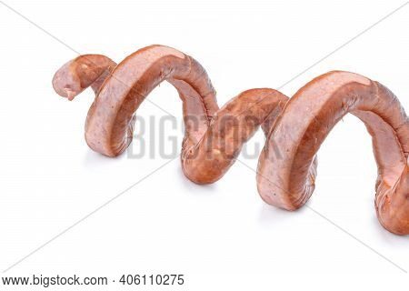 Smoked Sausage Twisted In A Spiral And Bound With A Beechnut, Isolated On A White Background.