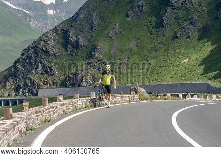 Grossglockner, Austria - Aug 8, 2020: Male Athlete Biker Walk On High Alpine Taxenbacher Fush Road