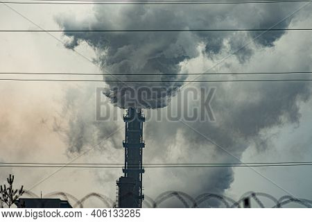 Thick Heavy Smoke Comes Out Of The Pipe Of The Metallurgical Plant.