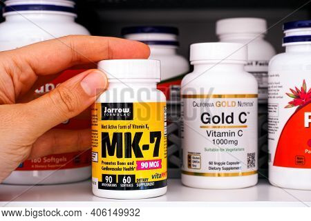 Tambov, Russian Federation - October 28, 2020 Woman Hand Taking Bottle Of Vitamin K2 (mk-7) By Jarro
