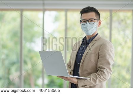 Business Employees Wearing Mask During Work In Office To Keep Hygiene Follow Company Policy.preventi