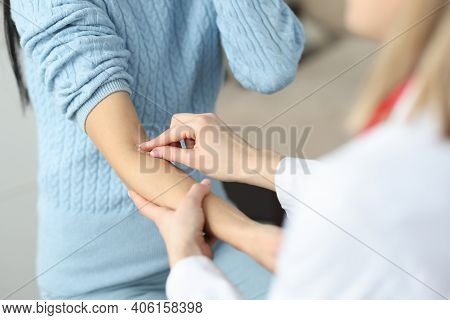 Doctor Putting Patch On Patients Forearm In Clinic Closeup. Rules For Taking Blood From Vein Concept