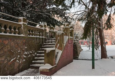 Manor Park In Iłowa In Winter. A Brick Bridge Over The Czerna Mała River.\nthe Town Of Iłowa In West