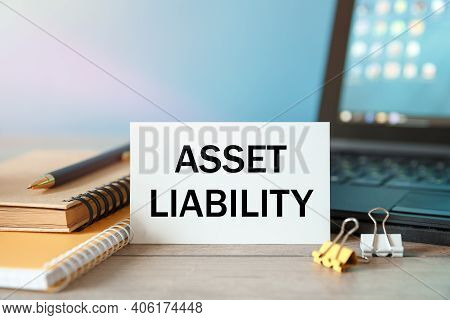 Desktop With Documents, Calculator And Notebook. On A Blockboard Inscription Asset Liability