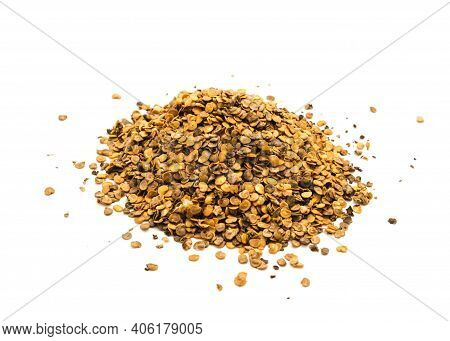 Large Mound Of Eggplant Or Aubergine Seeds In Plastic Container Isolated On White Background