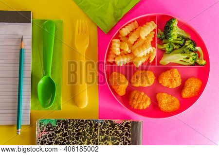 At Home Schooling Chicken Nugget Lunch Served On Tray With French Fries And Broccoli