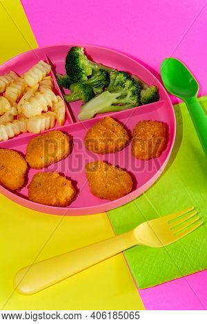 At Home Schooling Chicken Nugget Lunch Served On Tray With French Fries And Broccoli