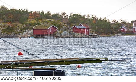 Traditional Red Cabins At Hvaler Island Coast In Norway