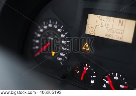 Capital T And Steering Wheel Warning Lit On Vehicle Display Of A Heavy Truck. Digital Tachograph Ind