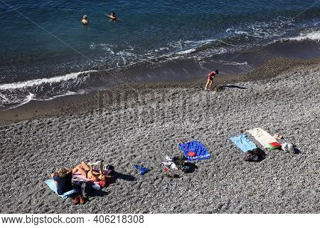 Camogli (ge), Italy - June 01, 2017: Tourist In Camogli's Beach In The Fishing Village Of Camogli, G
