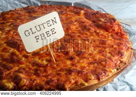 Unsliced Crispy Nyc Style Pizza Pie On Tin Foil