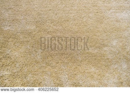 Surface Of Beige Carpet. Frieze Wool Material Carpeting.