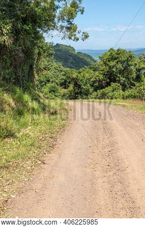 Dirty Road With Forest And Valley