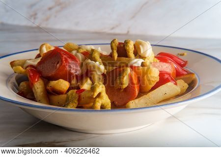 Peruvian Fast-food Salchipapas French Fries And Sliced Sausage