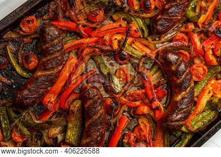 Broiled Sausage Onions And Peppers With Cherry Tomatoes And Thyme