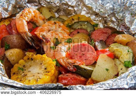 American Surf And Turf Dinner Cooked And Served In Tin Foil Packet Featuring Shrimp Multicolored New