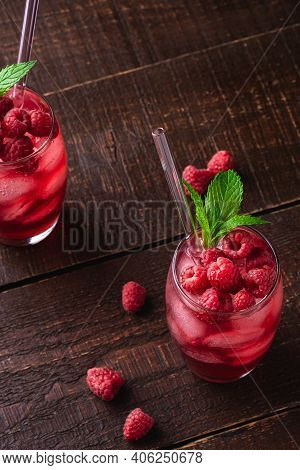 Fresh Ice Cold Berry Juice Drink With Mint, Summer Raspberry Lemonade In Two Glass With Straws On Br