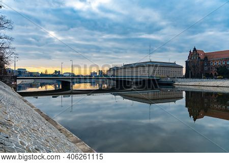 Wroclaw, Poland - March 19 2020 Beautiful Sunrise Over Grunwaldzki Bridge And Peace Bridge Reflected