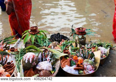 Holy Offerings Of Fruits Flowers Lamps And Cloths In River To Sun God On The Occasion Of Chhath Puja