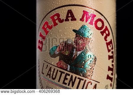 Birra Moretti, A Premium Lager Beer With Water Droplets On Black Background. Studio Photo Shoot In B