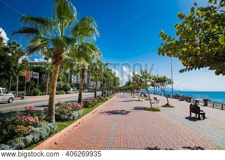  Alanya , Turkey- October 20, 2020: Alanya promenade - Ahmet Tokus Boulevard along all Beaches. Tourists promenade along the alley along the Mediterranean coast. Alanya, Turkey