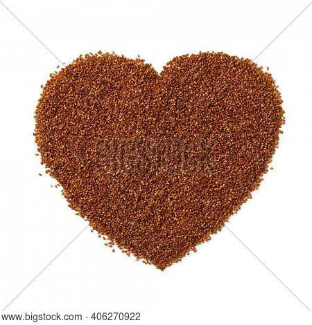 Raw teff seed in heart shape isolated on white background 