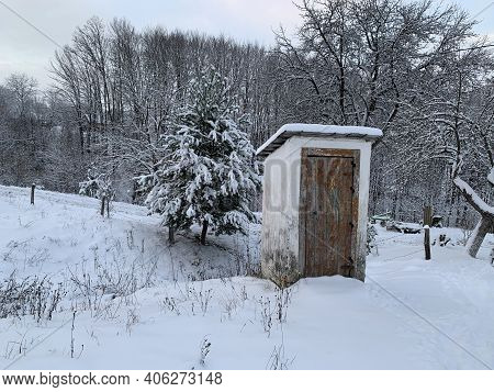Country Toilet In The Winter Outdoors. Outdoor Toilet Construction. Cabin - Toilet In The Forest On