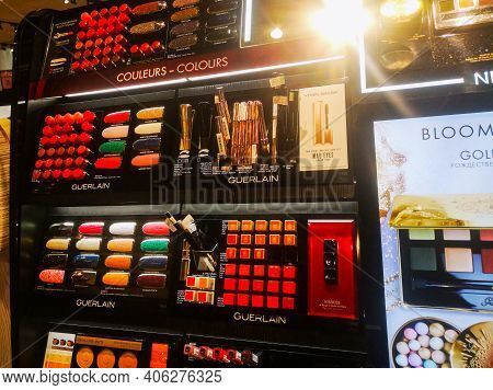 A Large Set Of Guerlain Goldenland Palettes And Eyeshadows Is Sold In A Cosmetics And Perfumery Stor