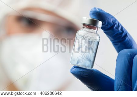 Cell Division Process Conceptual Illustration,lab Scientist Holding Ampoule Vial With Cell Nucleus M