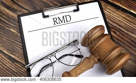 Paper With Rmd With Gavel, Pen And Glasses On The Wooden Background