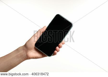 Mykolaiv, Ukraine - July 9, 2020: Woman Holding  Iphone X On White Background, Closeup