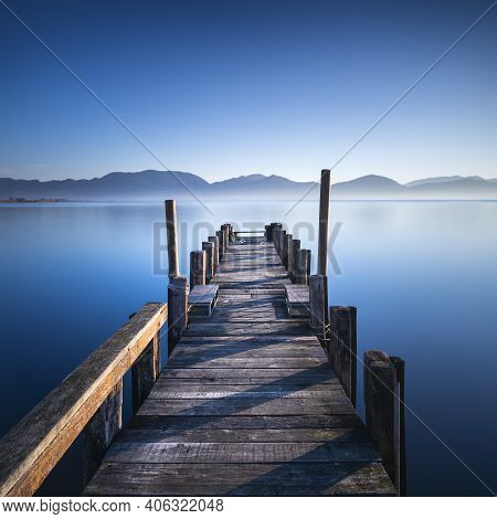 Wooden Pier Or Jetty And Lake At Sunrise. Torre Del Lago Puccini, Versilia, Massaciuccoli Lake, Tusc