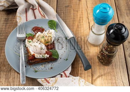 Poached Poached Eggs On Toasted Bread. Wooden Table. Top.