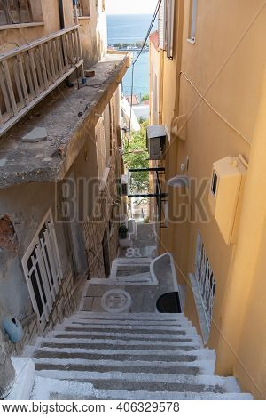 Small Street With Sea Background And Green Plant. Dreamy With Little Balconys