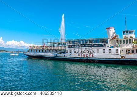 Geneva, Switzerland - Aug 15, 2020: Restaurant Boat In The Harbor Of Geneva Lake And Jet Deau Founta