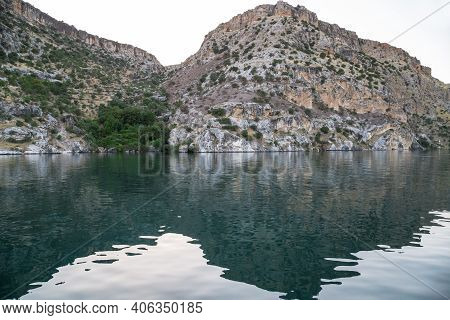 These Are The Rocky Banks Of The Euphrates River, Reflected In The Turquoise Waters Of The River In 