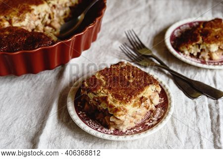 Apple And Cheese Cobbler Crisp. Cobbler Or Crumble Dessert With Apples In Ceramic Baking Form On Bei