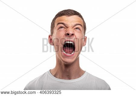 Scream. The Young Man Shouts. Isolated On White Background.