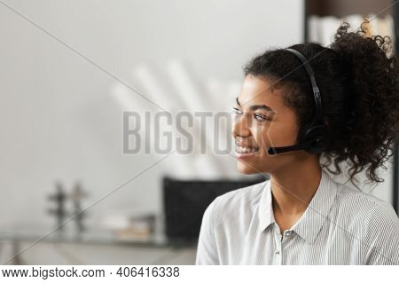 Young Thoughtful African American Female Sudent In A Headset Is Listening To An Online Webinar, Stud