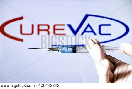 Madrid, Spain- February 3, 2020: Hand On White Surgery Glove Holding Syringe With Covid Vaccine. In 