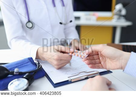 Doctor Therapist Giving Blister With Pills To Patient Closeup. Arterial Hypertension Treatment Conce