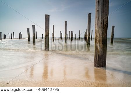 Long Exposure Seascape In Retro Colors. Taken At The North Sea In Petten With The Pole Village In Th