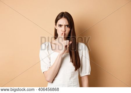 Angry Young Girl Scolding Bad Behavious, Shushing And Frowning Mad, Tell To Be Quiet, Looking Disple