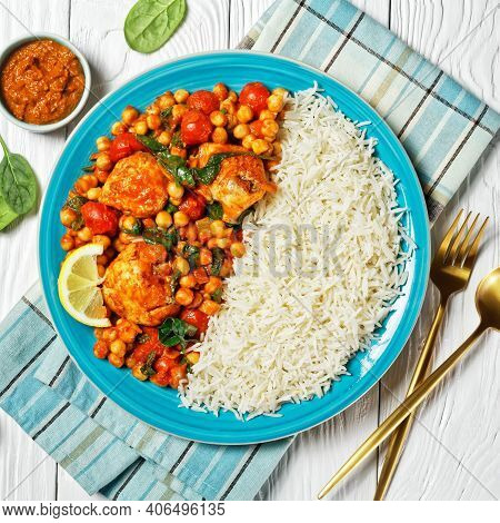Chicken And Chickpea Curry With Rice With Cherry Tomatoes, Spinach, Ginger, Yellow Curry Paste Serve