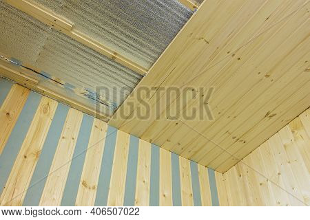 Finishing Of The Ceiling Insulated With Foamed Polyethylene With Wooden Clapboard During The Constru