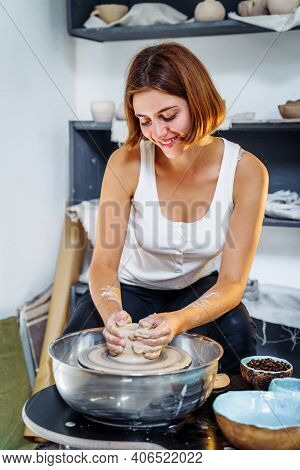 Painstaking Work Of A Professional Charming Female Potter Enjoying Art Of Pottery And Manufacturing
