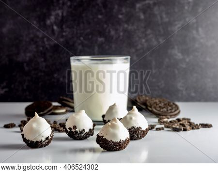 Cookies And Cream Cake Balls, Truffle Like Dessert, With A Fresh Glass Of Milk And Sandwich Cookies 
