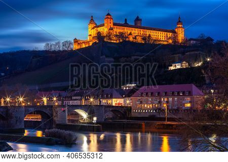 View Of Marienberg Fortress And Old Main Bridge, Alte Mainbrucke In Wurzburg At Night, Bavaria, Germ